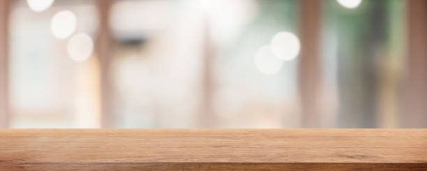 istock Empty wood table top and blurred coffee shop and restaurant interior background - can used for display or montage your products. 1255692307