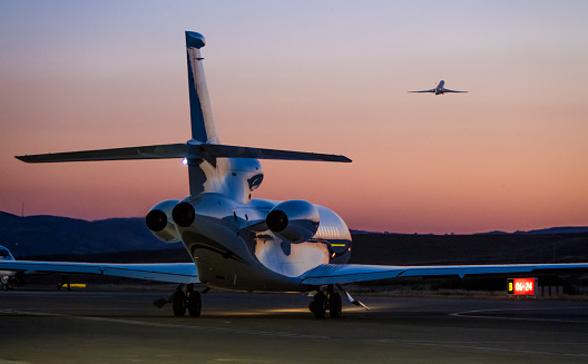 Private Jet ready to take off at dusk