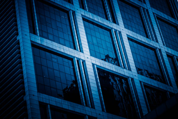 istock Urban abstract - windowed corner of office building 1255695352