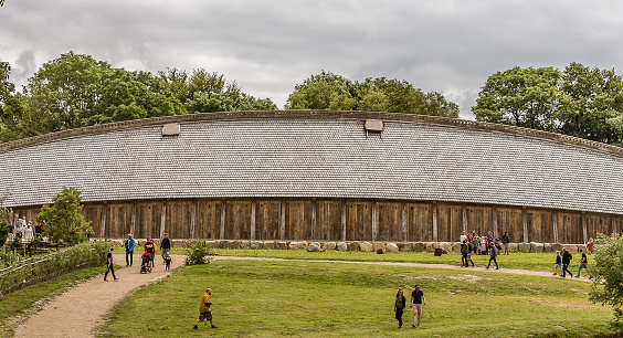 people in front of The King's Hall, a medieval longhouse in Lejre, Denmark, July 9, 2020