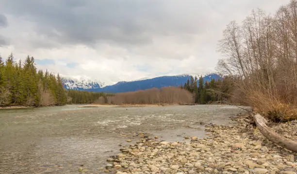 Photo of A cold Kalum River in Spring, with Mount Garland in the background