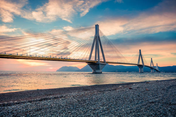 dramatic evening scene with rion-antirion bridge. colorful spring scene of the gulf of corinth, greece, europe. beauty of countryside concept background. artistic style post processed photo. - gulf of corinth imagens e fotografias de stock