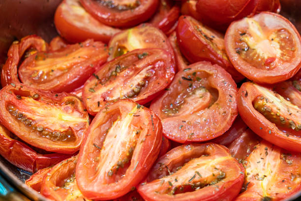 istock Close up freshly baked cherry tomatoes in buffet plate. 1255703582