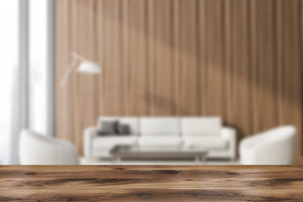 istock Table in wooden lounge with sofa and armchairs 1255703972