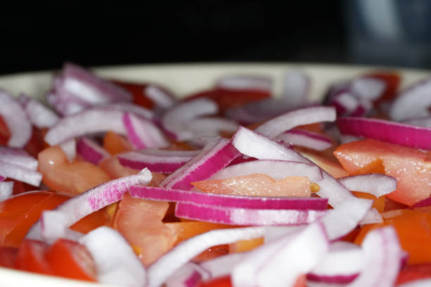 This ia onion and tomato salad with washed tomatoes and peeled onion