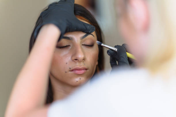 istock Makeup artist at work, professional in action, beauty salon and creative classes 1255704864