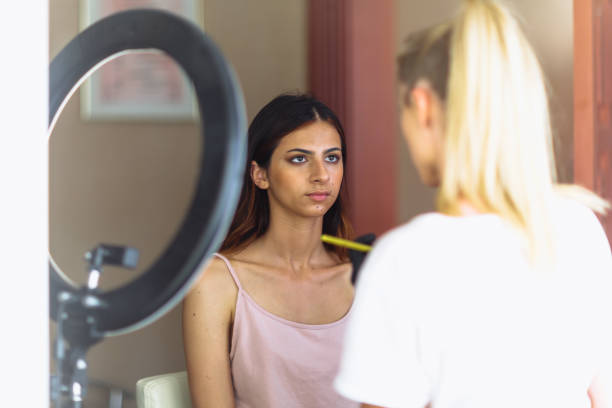 istock Makeup woman artist at work, professional in action, beauty salon and creative classes 1255704963