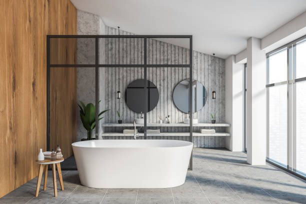 istock Stone and wooden bathroom with glass wall 1255704995