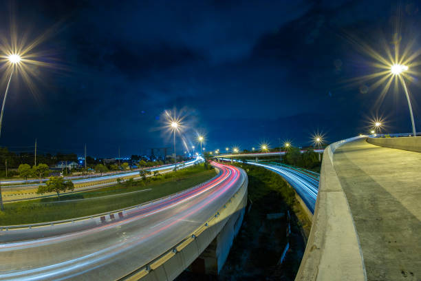 istock Long-exposure roads and bridges at night 1255705997