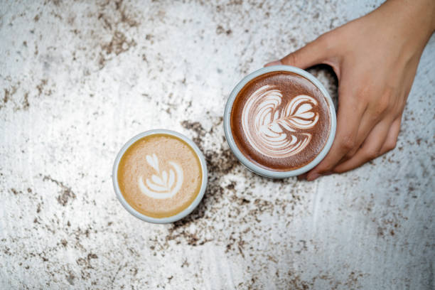 istock Coffee latte and hot chocolate with forth art on top of metal table 1255706132