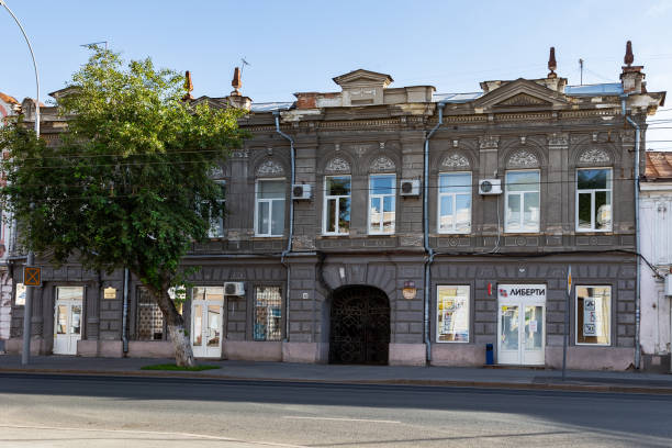 Landmark in the city center, the facade of a beautiful old building on Moskovskaya street, architecture of the 19-20 century historical monument Saratov, Saratov Region, Russia - 07/06/2019: Landmark in the city center, the facade of a beautiful old building on Moskovskaya street, architecture of the 19-20 century historical monument moskovskaya stock pictures, royalty-free photos & images