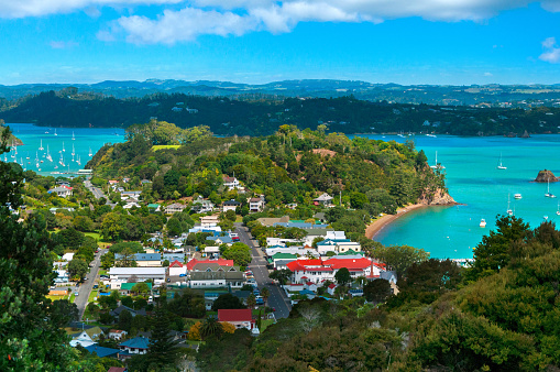 Scenic landscape of rural town and harbor with boats and yachts in clear turquoise water of the ocean, View from Flagstaff Hill