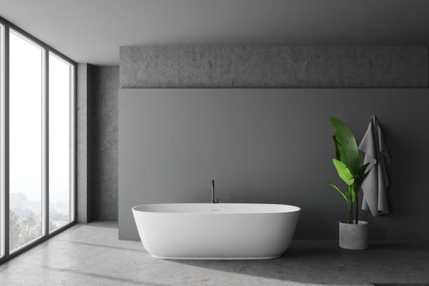 istock Panoramic grey and stone bathroom with tub 1255709501
