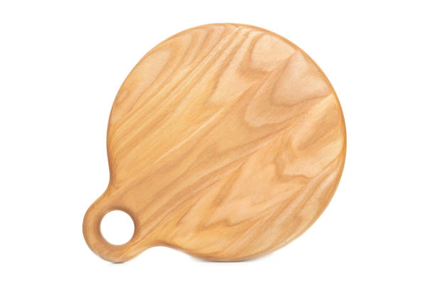istock Wooden cutting board isolated on white background 1255709598