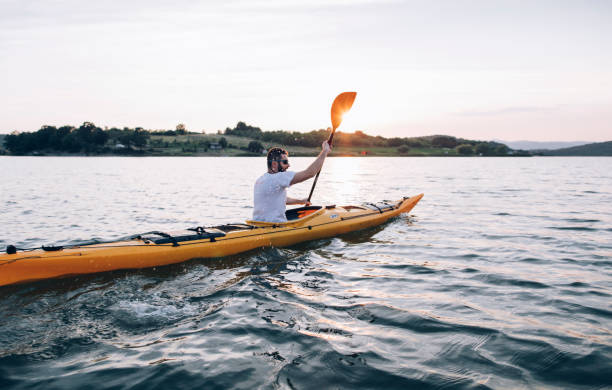istock Kayaking in beautiful lake landscape 1255710591