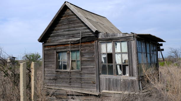 istock Abandoned houses on personal plots 1255710773
