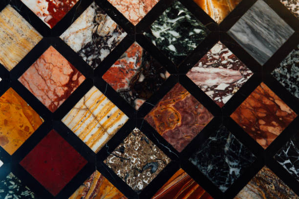 istock Old vintage wall with multicolored marble squares textured background structure 1255710823