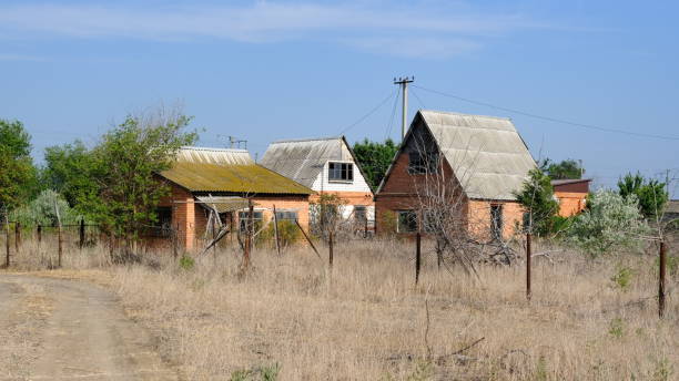 istock Abandoned houses on personal plots 1255710878