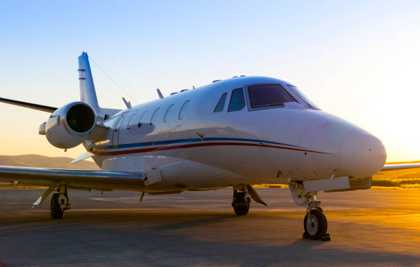 istock Private Jet at airport at sunset 1255712016