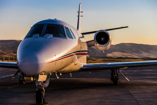 istock Private Jet at airport at sunset 1255712018