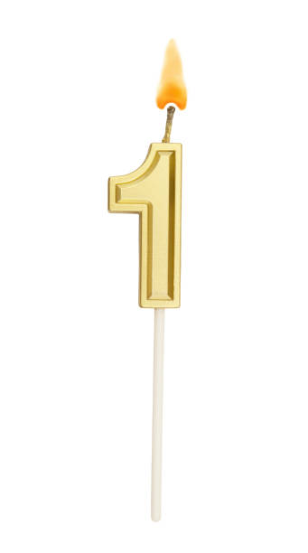 istock Birthday golden candle on white background, number 1 1255713656