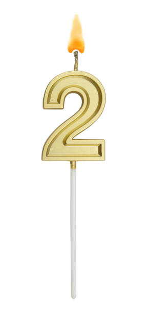 istock Birthday golden candle on white background, number 2 1255713690