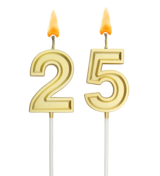 istock Birthday golden candles on white background, number 25 1255713705