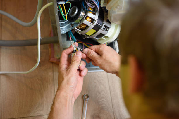 istock handyman repairs dishwasher 1255713803