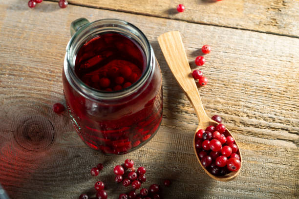istock Glass of cranberry fruit drink. 1255717190