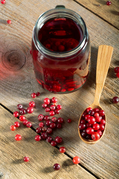 istock Glass of cranberry fruit drink. 1255718009