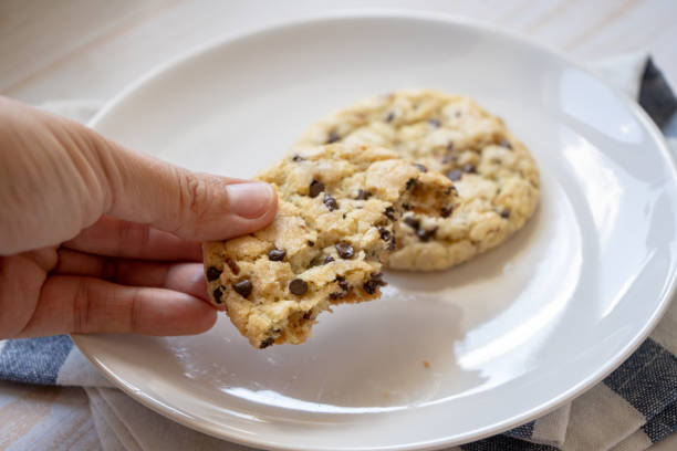 istock fresh baked classic chocolate chip cookies with nuts on a plate 1255718612