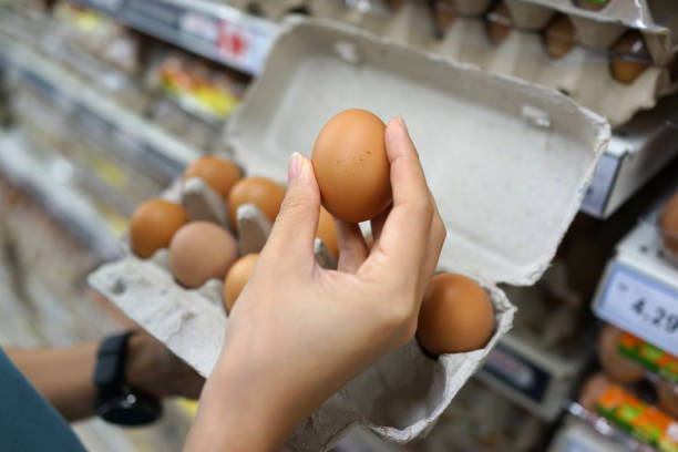 istock Fresh brown eggs for sale on market stall 1255725128