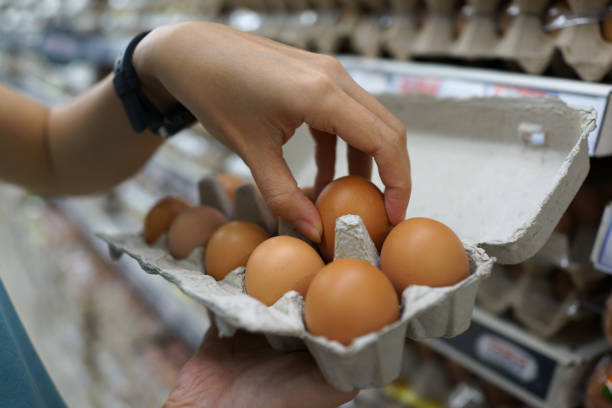 istock Fresh brown eggs for sale on market stall 1255725133