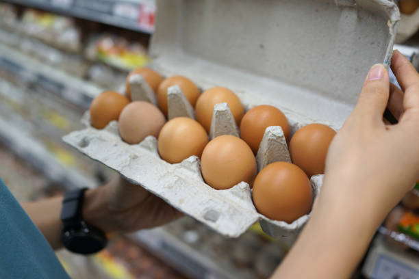 istock Fresh brown eggs for sale on market stall 1255725136