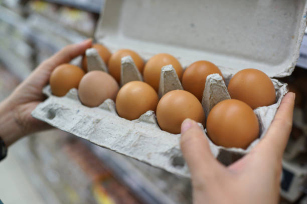 istock Fresh brown eggs for sale on market stall 1255725153
