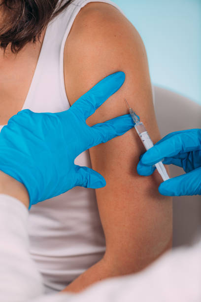 istock Woman Getting a Corona Virus Vaccine Trial 1255726591
