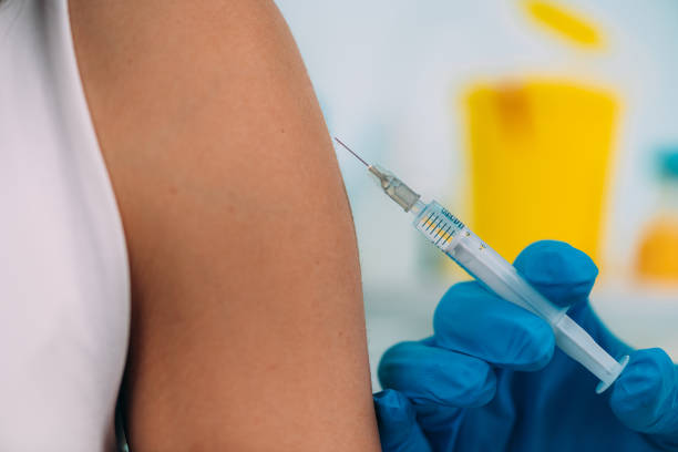 istock Woman Getting a Corona Virus Vaccine Trial 1255726602