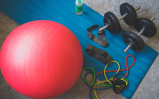 Dumbbells, fitball and resistance bands at home.