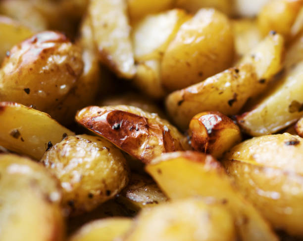 istock Young potato baked in the oven. 1255727192