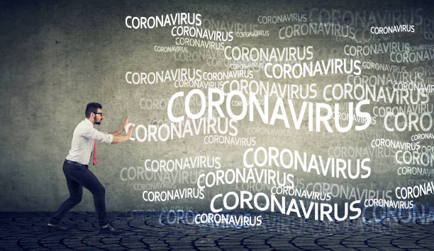 istock man gesturing stop to coronavirus infection 1255728478
