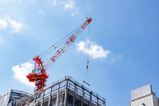 Building construction site and crane