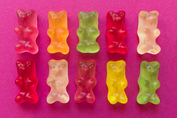 istock Multi-colored jelly bears on a pink background. 1255729430