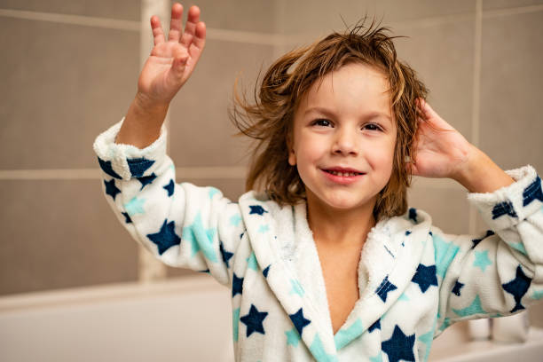 istock Close-up boy drying his hair 1255729443