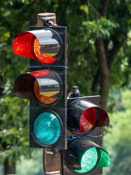 istock Traffic light against with green blurred background. 1255730556