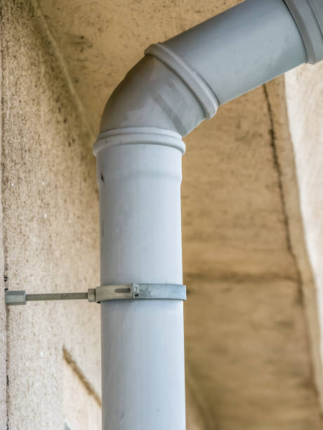 istock Close up with a drain system installation. Drainpipe on an apartment building. 1255730561