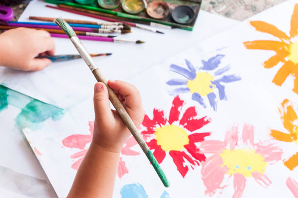 istock Doing arts and craft. Painting a drawing with watercolors 1255731089