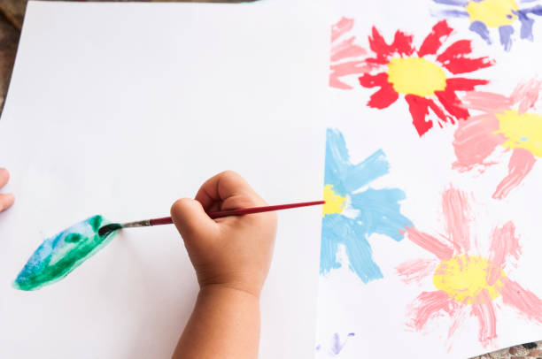 istock Doing arts and craft. Painting a drawing with watercolors 1255731091