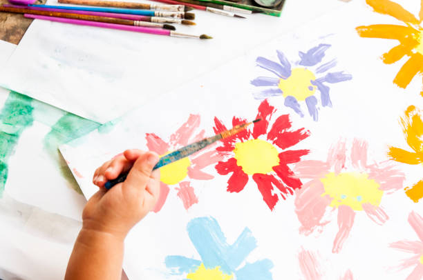 istock Doing arts and craft. Painting a drawing with watercolors 1255731094
