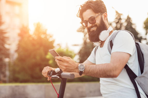 cheerful hipster using smartphone during ride - hipster people surfing the net internet imagens e fotografias de stock