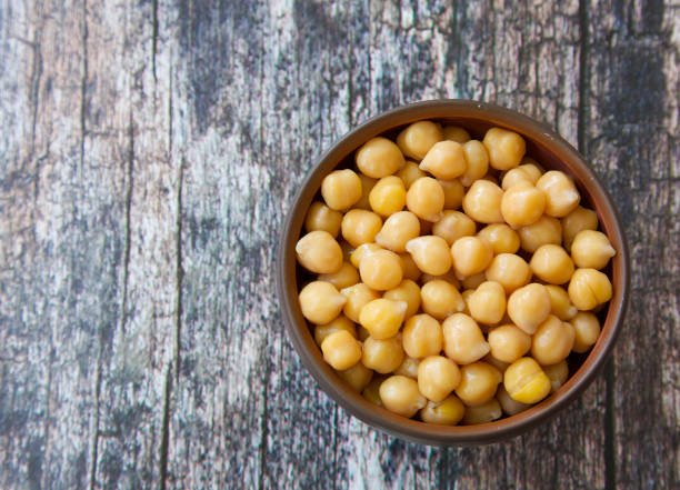 istock Clay bowl full of boiled and  and drained chickpeas 1255734975